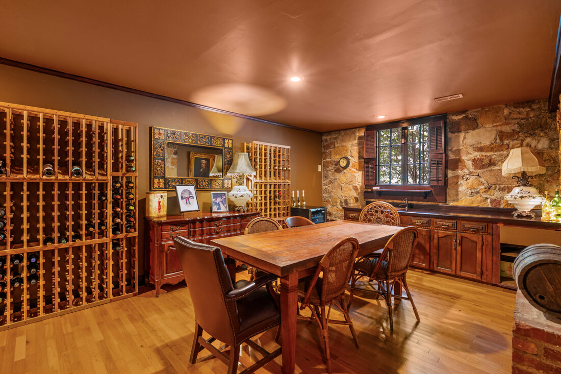 Lower-level wine cellar with racking and tasting table